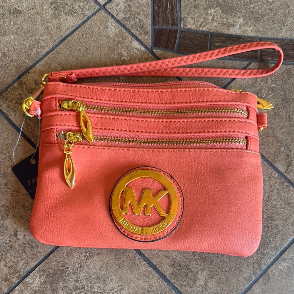 Michael Kors Orange Clutch Wristlet with Elegant Design This is a fashion bag